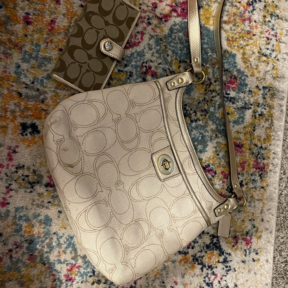 Coach purse, 2 very small stains on front should be easily removed. Cream color